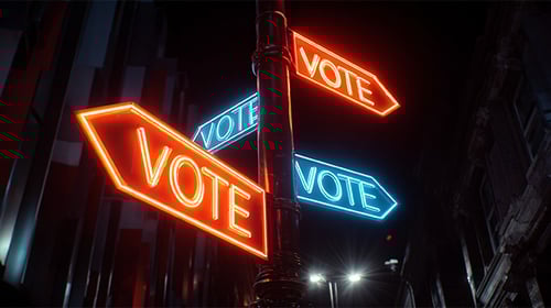 Neon voting signs on a street corner